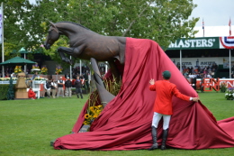 Eric Lamaze pulling back sheet to reveal the Hickstead Statue