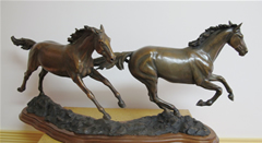 Bronze sculpture of horses galloping, Running Free