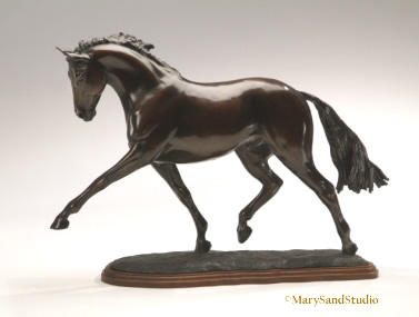 Bronze dressage horse sculpture of hanoverian horse performing the extended trot. Sculpture titled Breathtaking