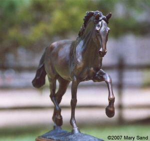 Dressage horse sculpture performing Passage