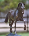 Horse statue of dressage horse performing the Passage